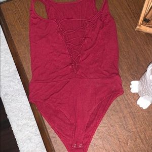 A strap up burgundy Bodysuy